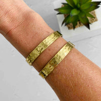 Summer gold bracelet with textured effect for summer days by the beach. KookyTwo.