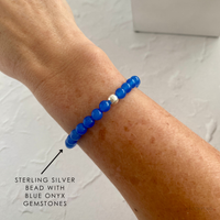 A beautiful blue onyx bracelet shining on a wrist a great go-to accessory for effortless everyday style and summer vibes!