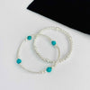 Set of two bracelets in sterling silver with turquoise gemstone gemstone beads. KookyTwo Jewellery.