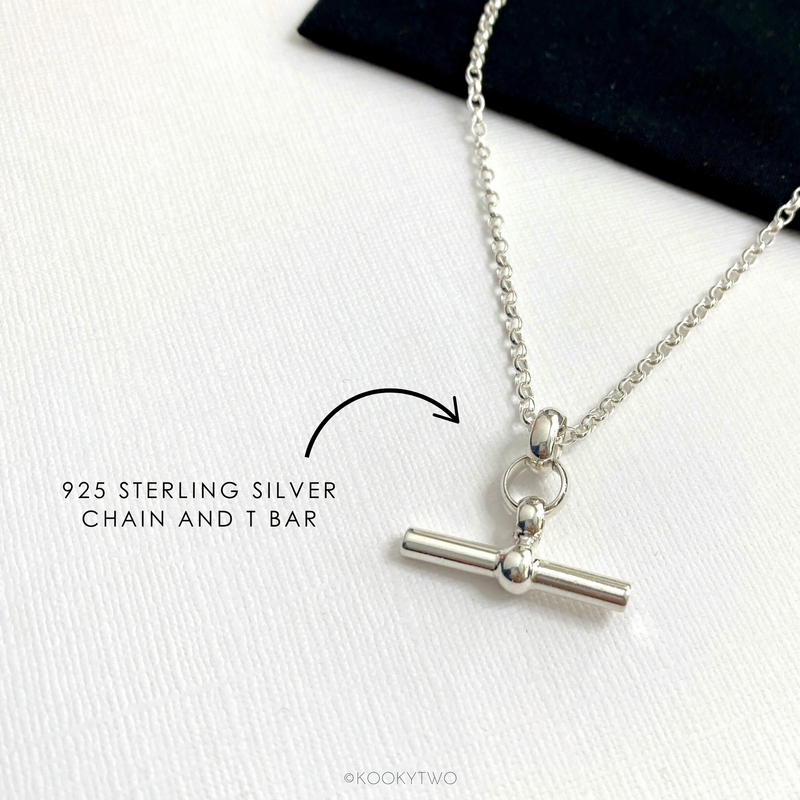 Sterling silver T-bar statement necklace displayed to showcase its modern elegance. KookyTwo.