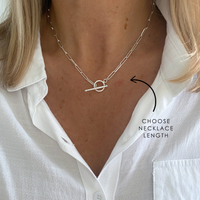 Statement chunky chain necklace in silver on a person wearing a white shirt with text 'CHOOSE NECKLACE LENGTH'.