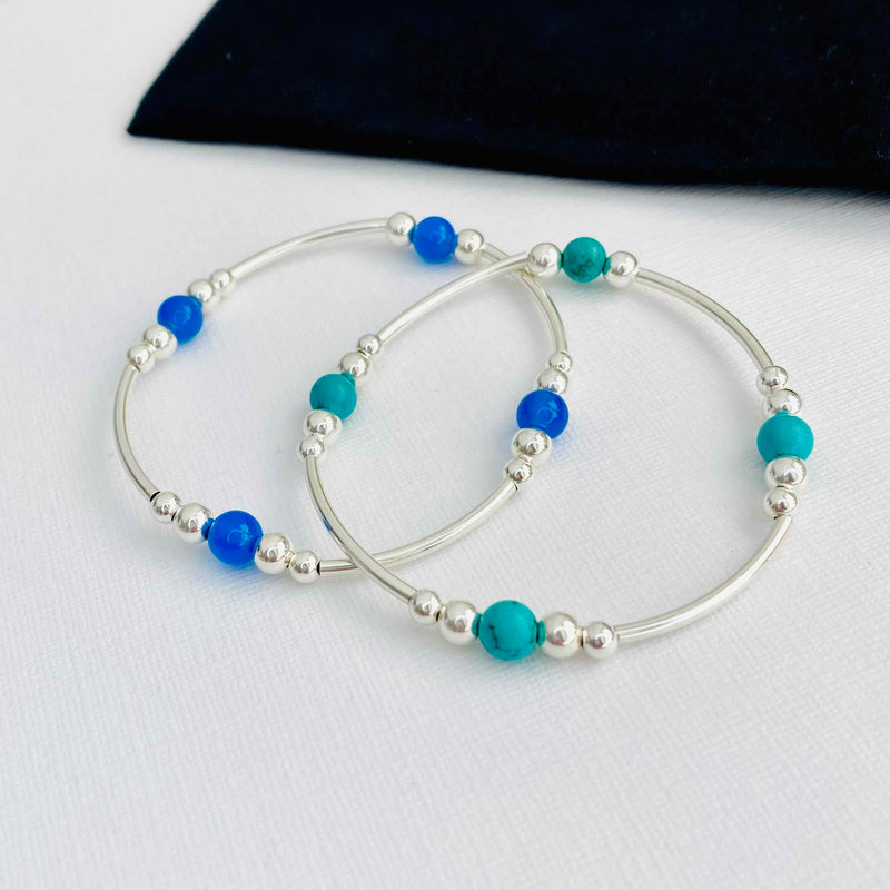 Set of two bracelets in sterling silver with turquoise gemstone beads and blue onyx gemstone beads. KookyTwo Jewellery.