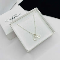 Two letter necklace with two silver initial charms on silver chain. KookyTwo.