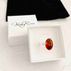 Adjustable sterling silver gemstone ring with amber stone. KookyTwo