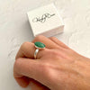Oval ring with green gemstone on sterling silver band. KookyTwo jewellery.