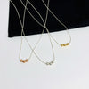 Dainty sterling silver chain with three shiny beads in a choice of silver, gold or rose gold. Kooky Two.