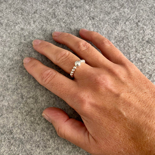 Sterling silver ring that stretches to get a comfortable fit. Ring for people with arthritis. Stretch ring to wear on more than one finger. Stacking ring to wear with other rings.