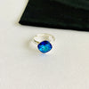 Sparkling blue crystal ring in sterling silver ring setting. Adjustable ring in sterling silver.