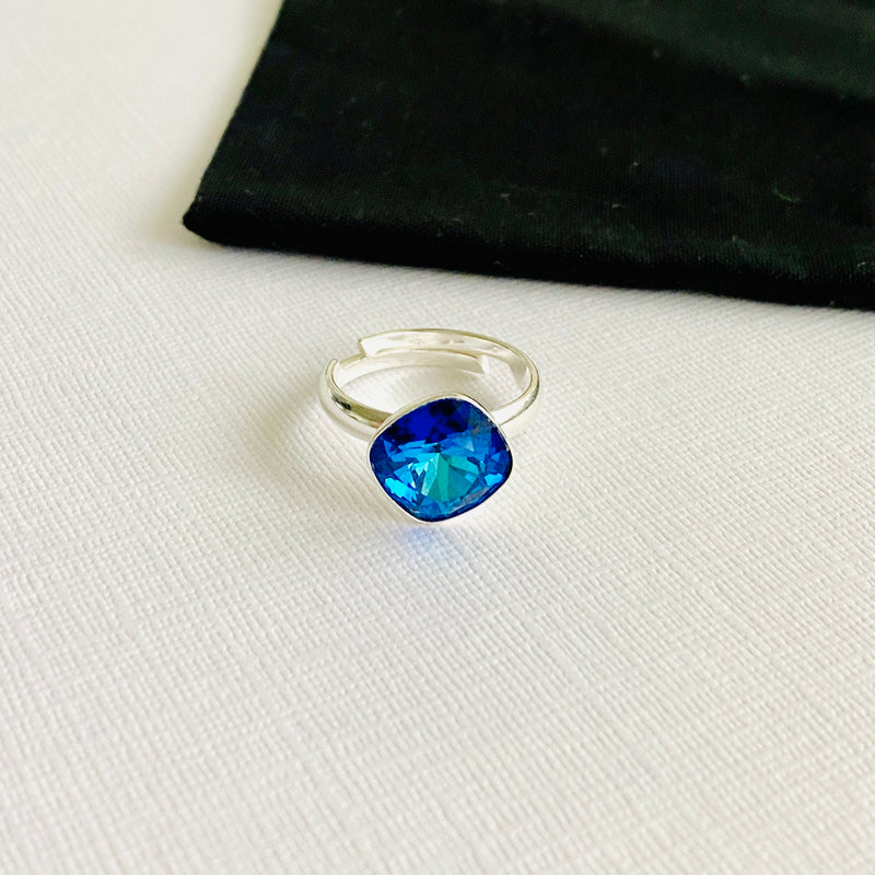 Sparkling blue crystal ring in sterling silver ring setting. Adjustable ring in sterling silver.