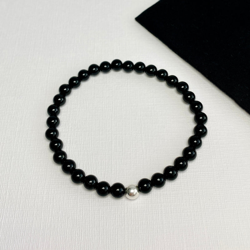 Bracelet for men or women with black beads. Unisex bracelet with black beads and silver beads.