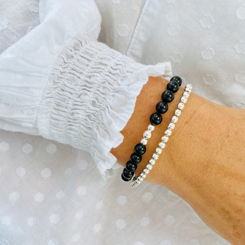 Bracelet set featuring Black Onyx gemstone bracelet and sterling silver bracelet.