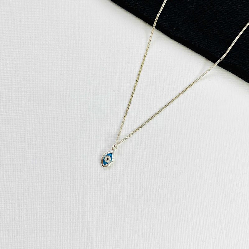 Evil eye jewellery necklace with blue eye charm on silver chain in sterling silver. Ladies eye necklace. KookyTwo.