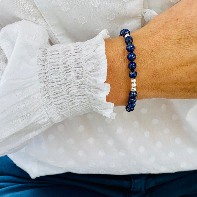 Our gorgeous Lapis Lazuli gemstone bracelet features beautiful deep blue lapis lazuli gemstones with subtle gold streaks running through, together shiny sterling silver beads.