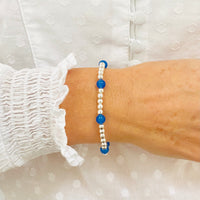 Blue onyx gemstone bracelet with sterling silver beads.