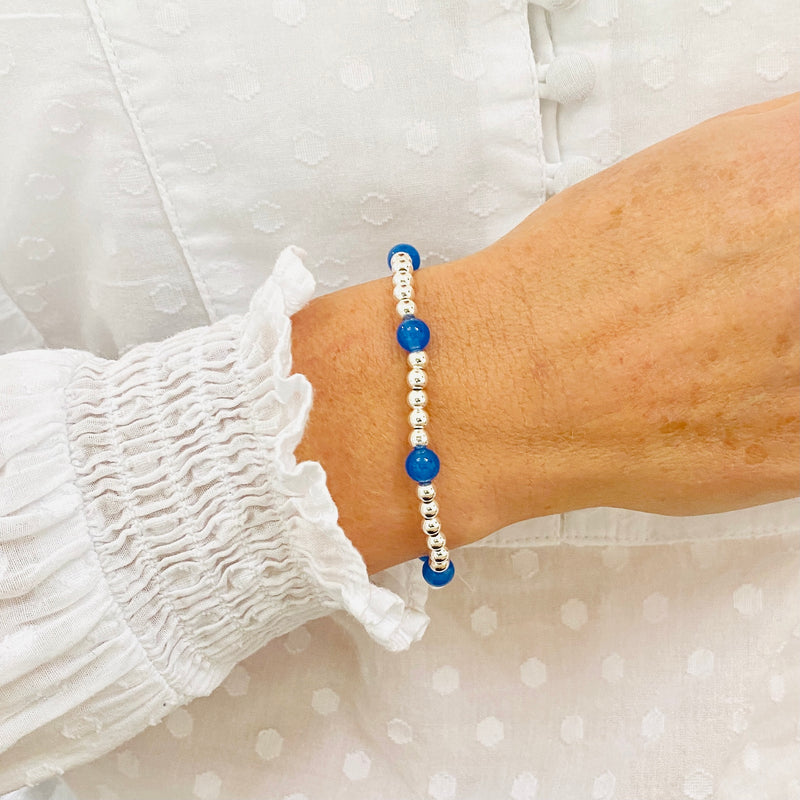 Blue bead bracelet with sterling silver beads and blue onyx gemstone beads.
