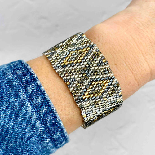 Wide bead bracelet featuring tiny miyuki beads with gold tones. KookyTwo Hampshire Jewellery.