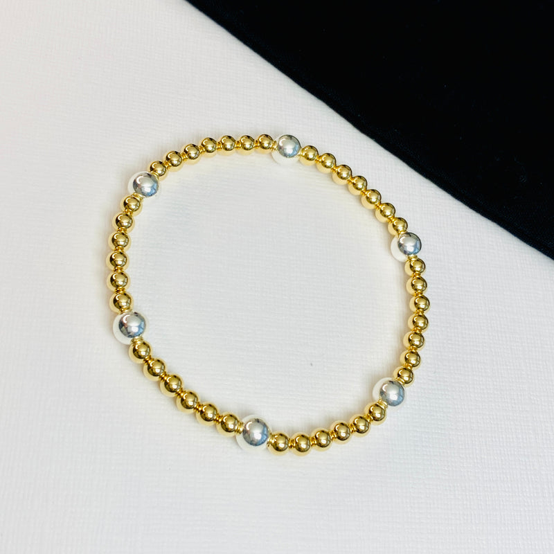 Unique bracelet with gold and silver beads.