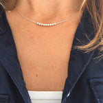 Dainty necklace with silver beads. Personalise with a different number of beads. KookyTwo.