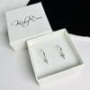 Silver mini hoop earrings with drop charms. KookyTwo Jewellery.