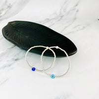 Evil eye beaded bracelet with blue or turquoise evil eye bead.