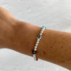 Dainty evil eye bracelet with colourful evil eye beads and sterling silver beads.