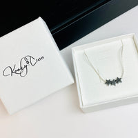 Necklace arrives in our white jewellery box.