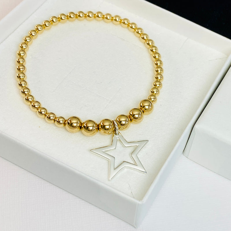 Silver star pendant on gold bead bracelet. Hand beaded bracelet jewellery design made in the UK.