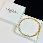 Gold and silver bracelet handmade in the UK. Bracelet comes in a free gift box.