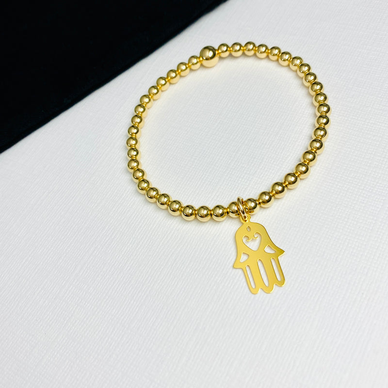Gold hamsa hand bracelet with 14k gold filled beads and charm.