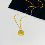Stylish gold pendant with a cut out falling leaf motif on a pretty gold chain. Kooky Two.