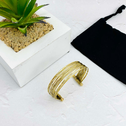 Summer styling with gold bracelet that can be adjusted for the perfect fit. Expandable bracelet for ladies. KookyTwo.