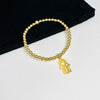 Gold hand of Fatima charm bracelet.