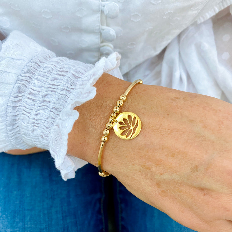 Ladies gold bracelet with flower charm. Perfect gift for yoga lover.