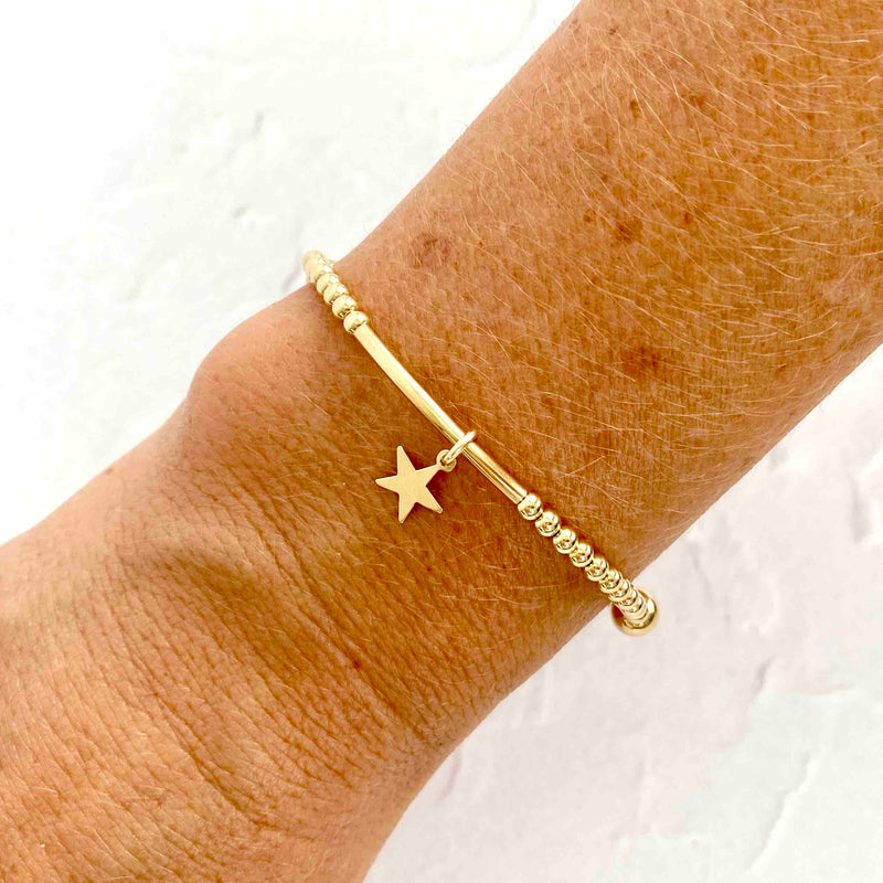 Gold bead bracelet with star charm. KookyTwo Jewellery.