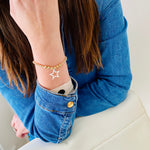Hand beaded gold bead bracelet with silver star charm. Made with 14k gold filled beads and sterling silver star charm.
