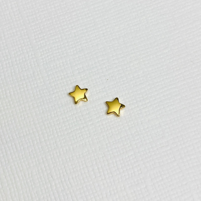 Gold Star Stud Earrings. Mini gold star stud earrings.