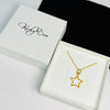Gold star necklace arrives in white gift box. Perfect gift for friend.