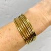 Gold cuff bangle with slim bands. Easily adjust bangle at the back. Adjustable bracelet to fit many wrist sizes. KookyTwo.