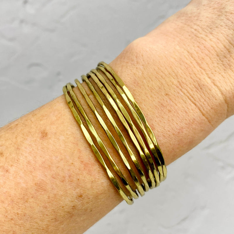 Gold cuff bangle with slim bands. Easily adjust bangle at the back. Adjustable bracelet to fit many wrist sizes. KookyTwo.