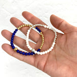 Lapis lazuli and 14k gold filled bead bracelet. Mother of pearl and sterling silver bead bracelet.