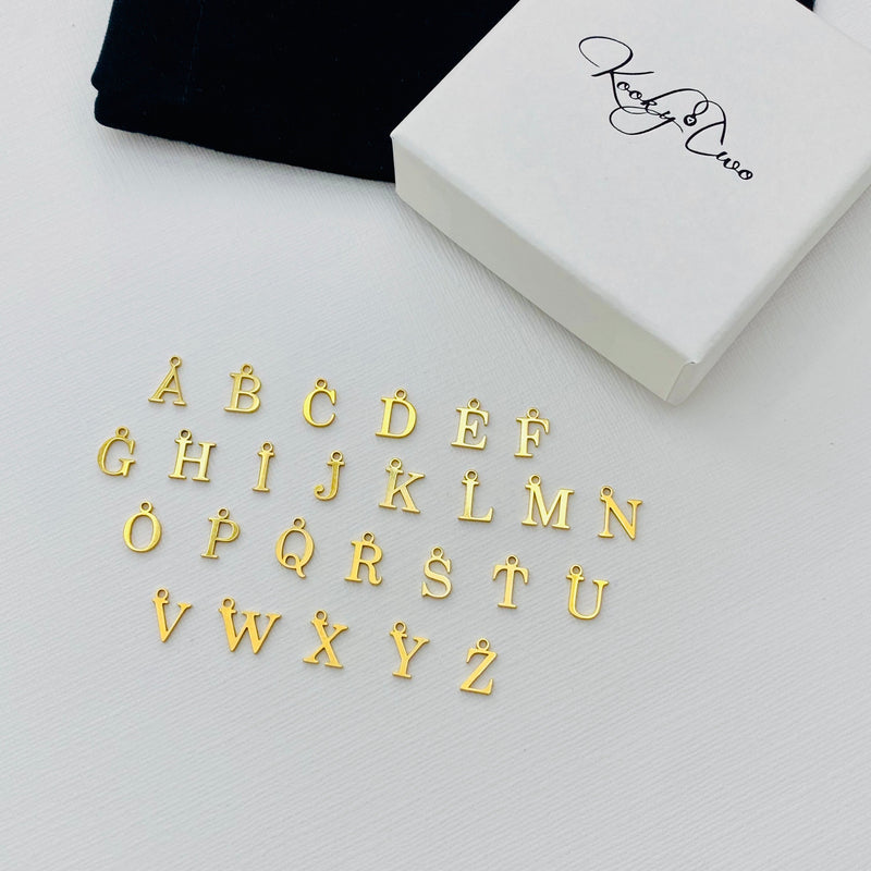 Monogram jewellery in gold. Letter charms in gold. KookyTwo.