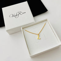 Name necklace with one letter charm with an initial of your choice to make a personalised necklace for you. KookyTwo.