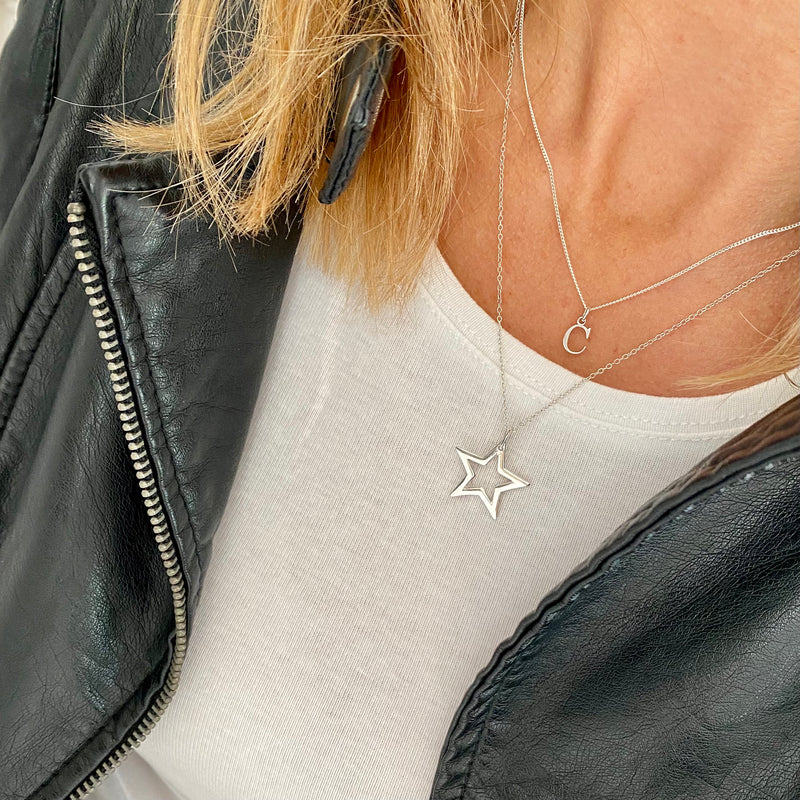 Sterling silver necklace set with dainty silver initial necklace and star charm necklace in two different lengths. KookyTwo