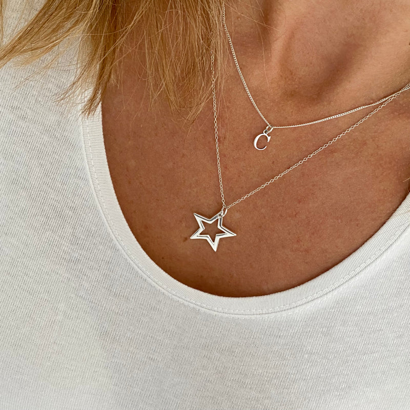 Necklace gift set with personalised letter necklace and star pendant necklace in two different lengths for effortless layering style. KookyTwo.