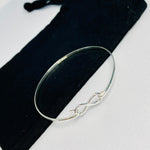 Womens sterling silver infinity charm bangle. Sterling silver infinity bangle.