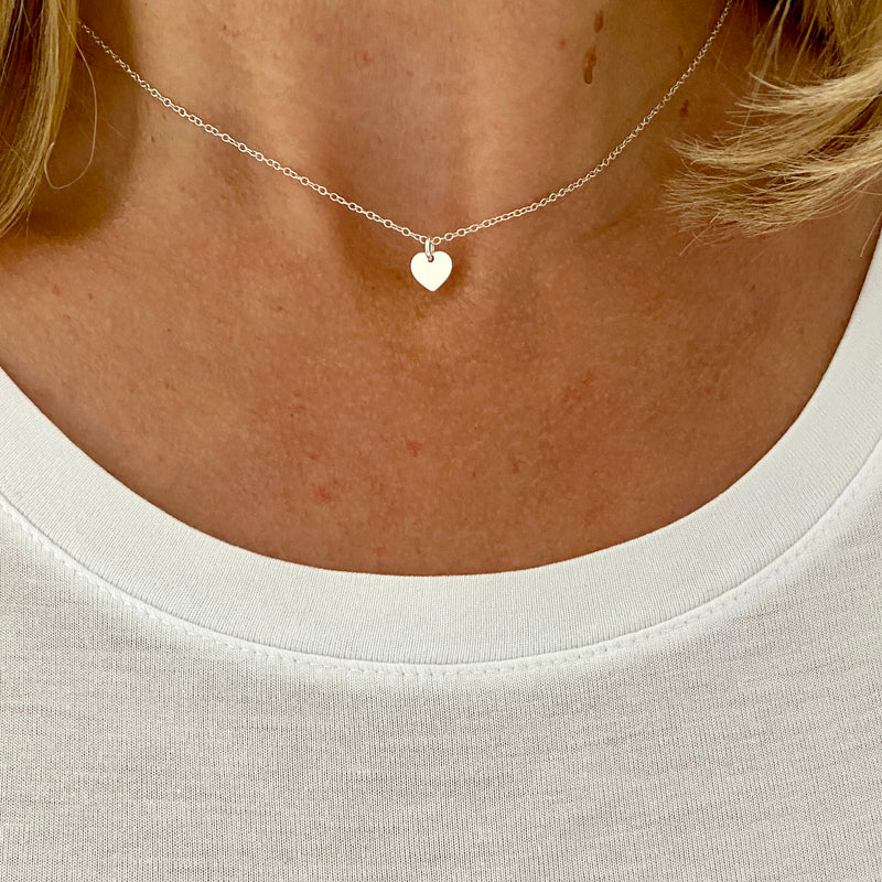 Choker length necklace with tiny heart charm in sterling silver