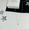 Sterling silver necklace with sparkly star bead.