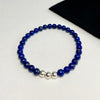 Bracelet for men or women with blue beads. Unisex bracelet with navy blue beads and silver beads.