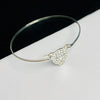 Silver bangle with leopard pendant for ladies who love animal print fashion.