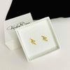 Sparkly lightning bolt earrings in gold. Kookytwo